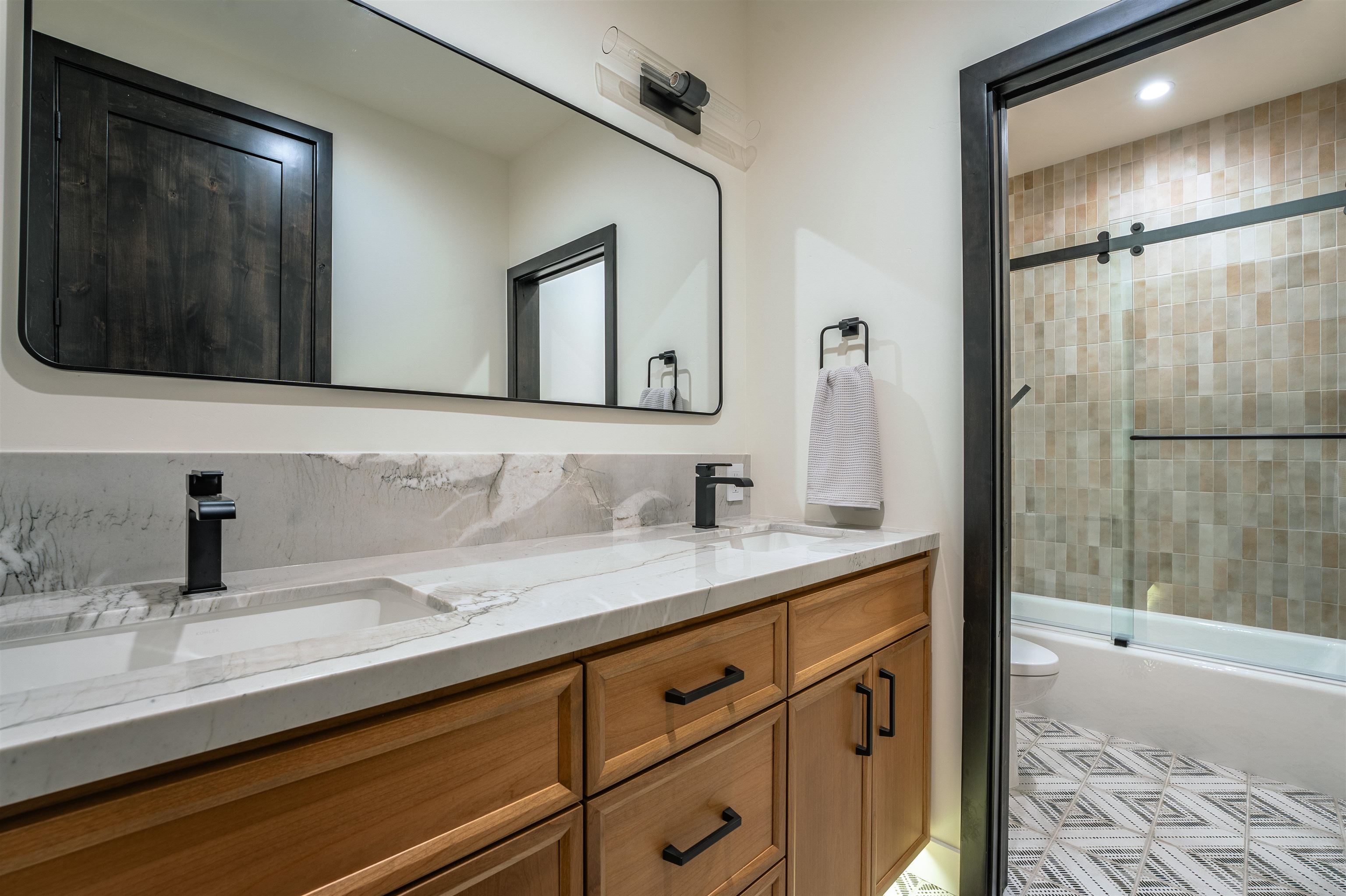 9090 Horned Lark Court Truckee, CA 96161 - Photo 21 of 28 a bathroom with a sink and a mirror