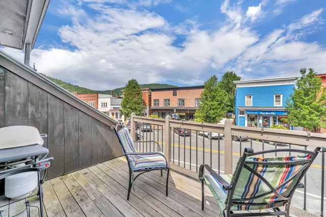 a view of a chairs on the roof deck