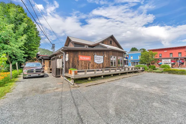 a view of a house with outdoor space and sitting area