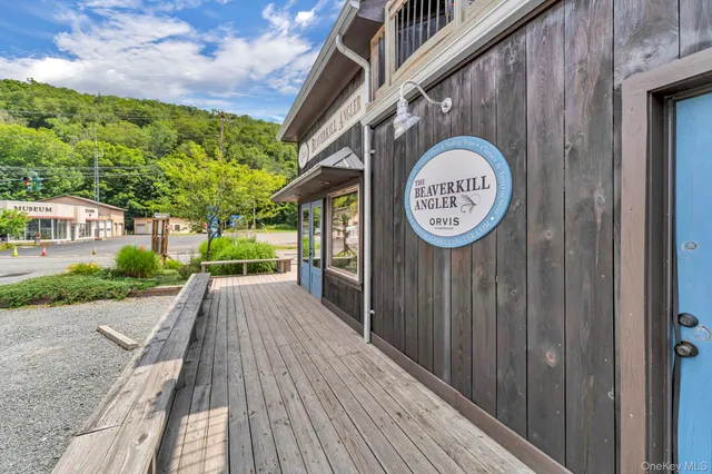 a view of a pathway of a house with a small yard