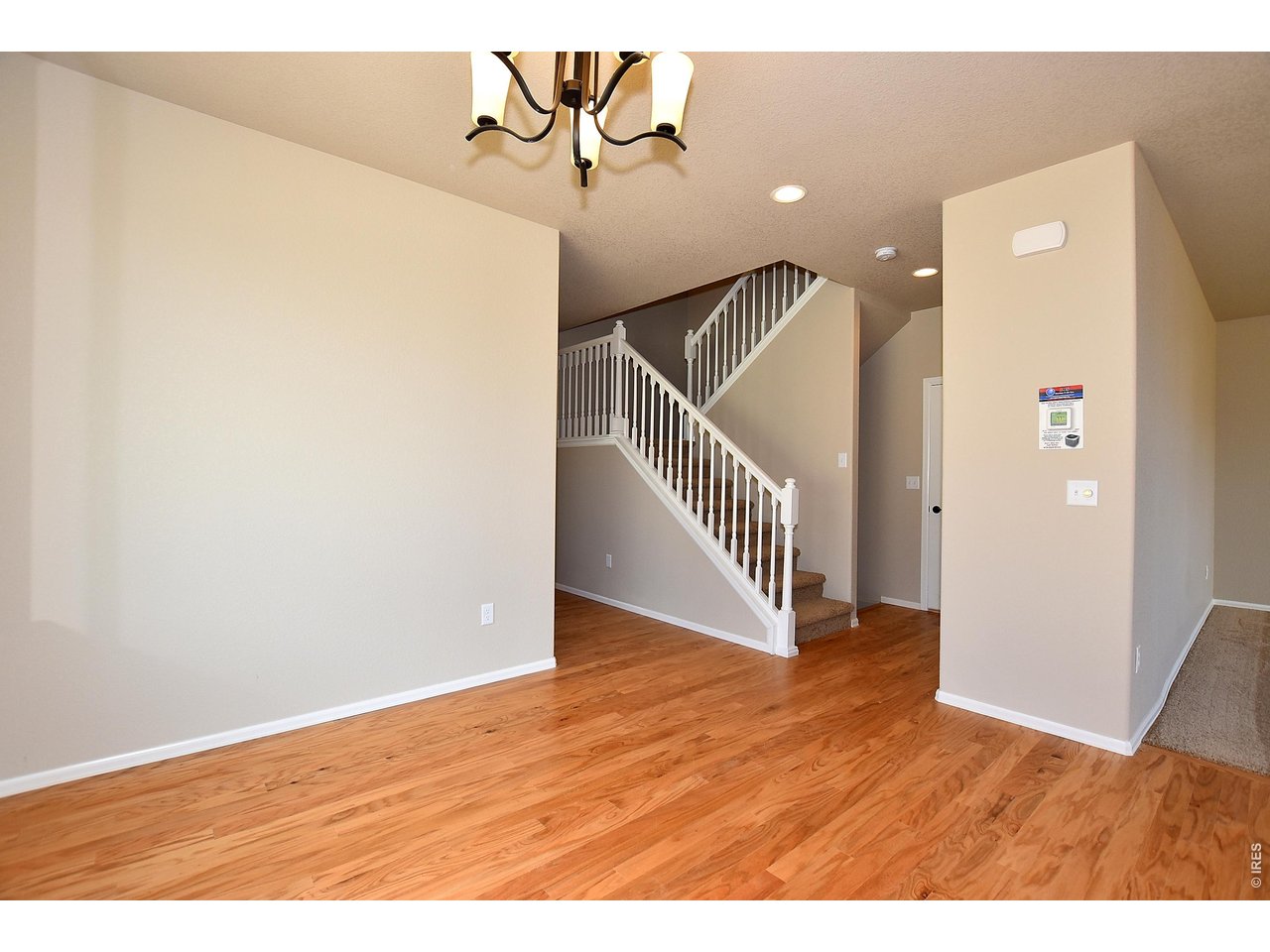 500 85th Avenue Greeley, CO 80634 - Photo 13 of 39 a view interior of a house with stairs and wooden floor