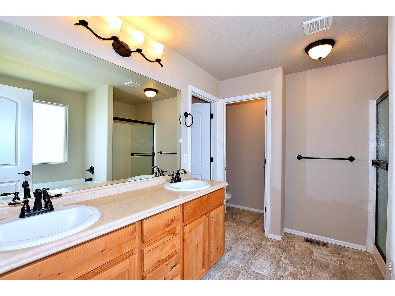 500 85th Avenue Greeley, CO 80634 - Photo 30 of 39 a bathroom with a sink and a mirror