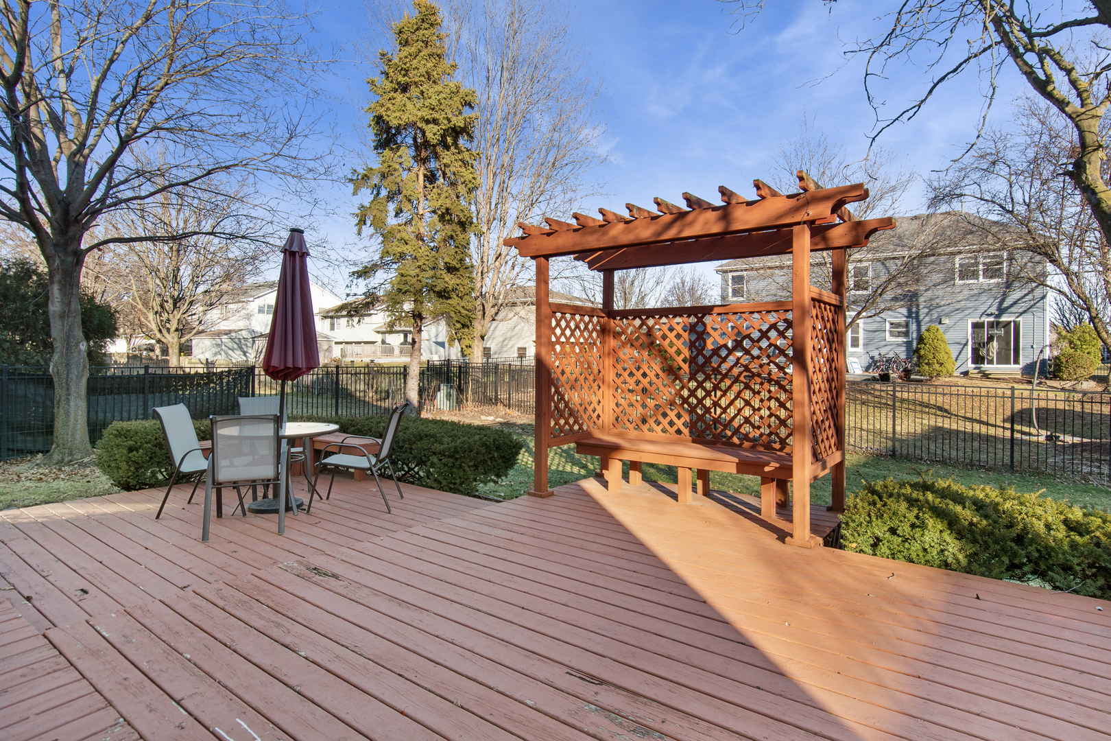 206 Sparrow Lane Bolingbrook, IL 60490 - Photo 18 of 22 a view of a patio with table and chairs with wooden floor and fence