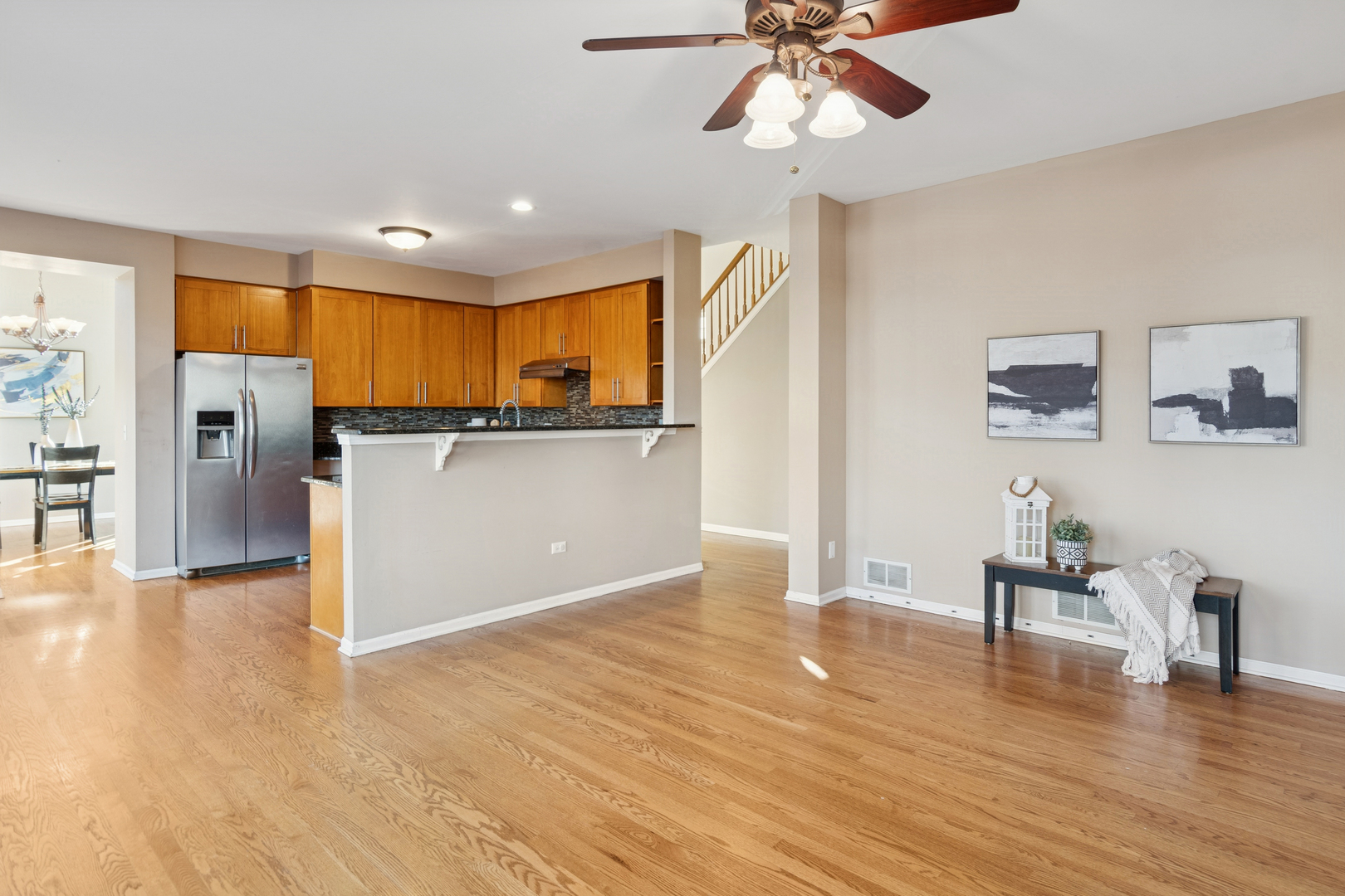 206 Sparrow Lane Bolingbrook, IL 60490 - Photo 7 of 22 a view of a kitchen with a sink cabinet a refrigerator and a chandelier
