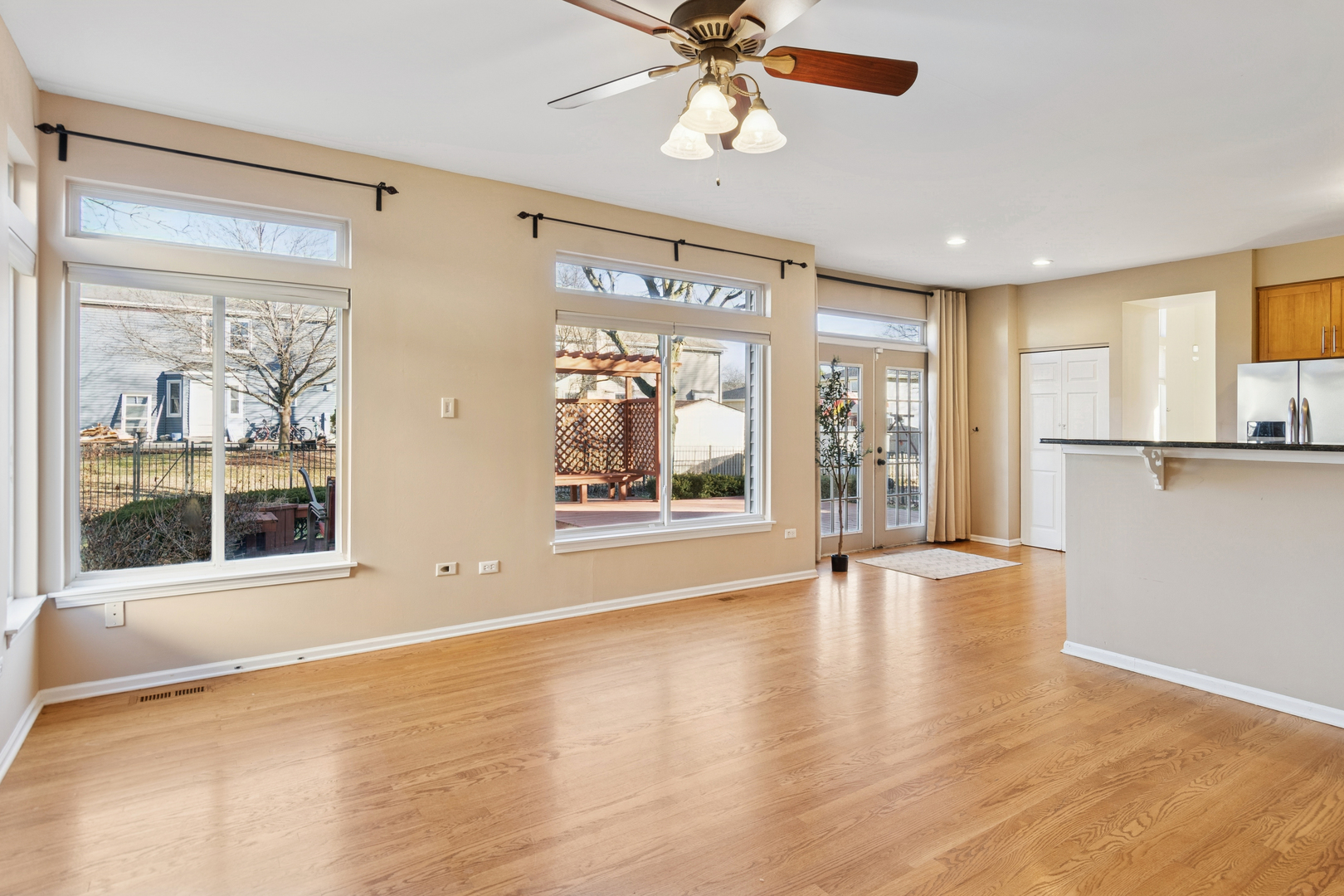 206 Sparrow Lane Bolingbrook, IL 60490 - Photo 9 of 22 a view of an empty room with a window and wooden floor