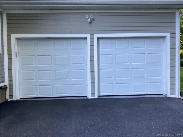 a view of a backyard with a wooden fence