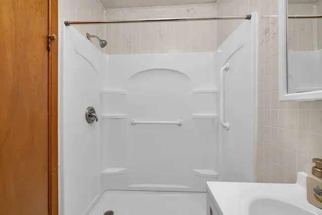 a bathroom with a shower and toilet
