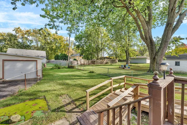 a view of a patio with a yard