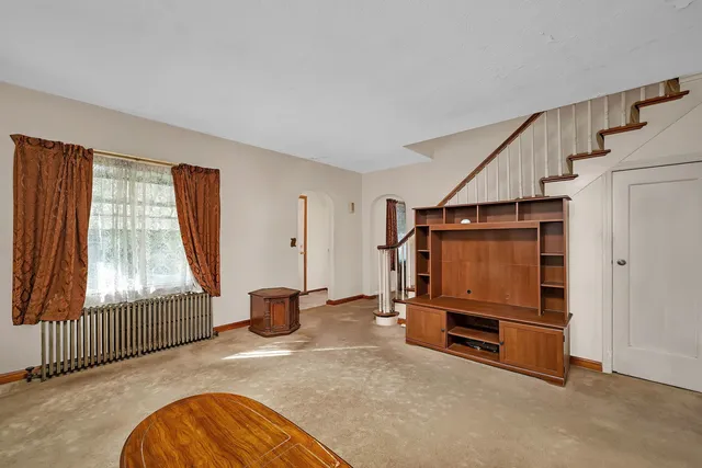 a living room with furniture and a window