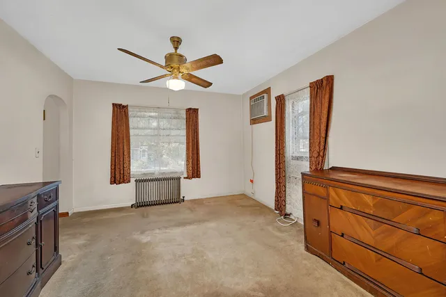 a view of room with window and ceiling fan
