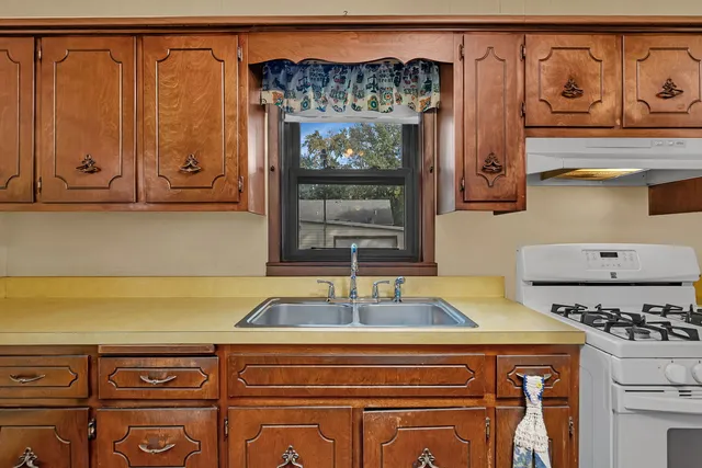 a kitchen with a sink and cabinets