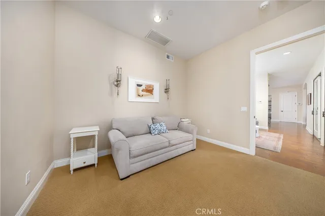 a spacious bedroom with a bed and large windows