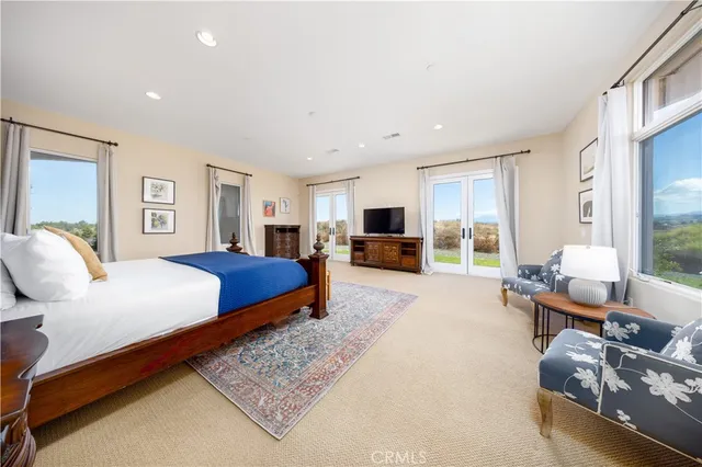 a spacious bathroom with a granite countertop tub sink and mirror