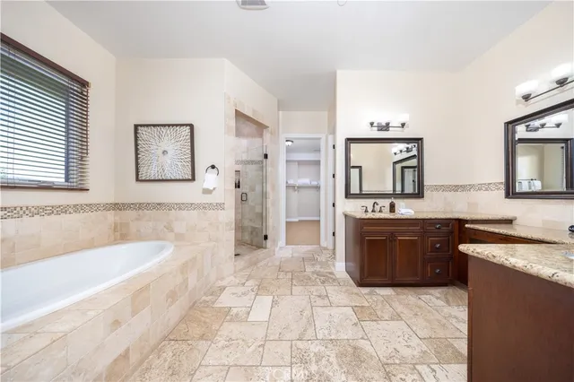 a large kitchen with a sink and a stove