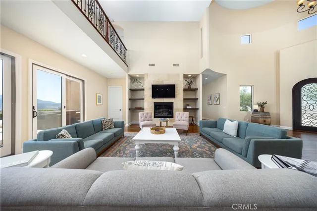 a bathroom with a granite countertop toilet and a sink