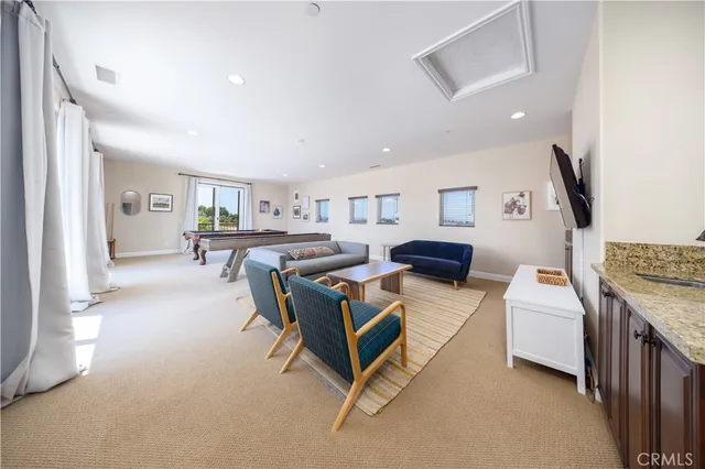 a living room with furniture and a rug