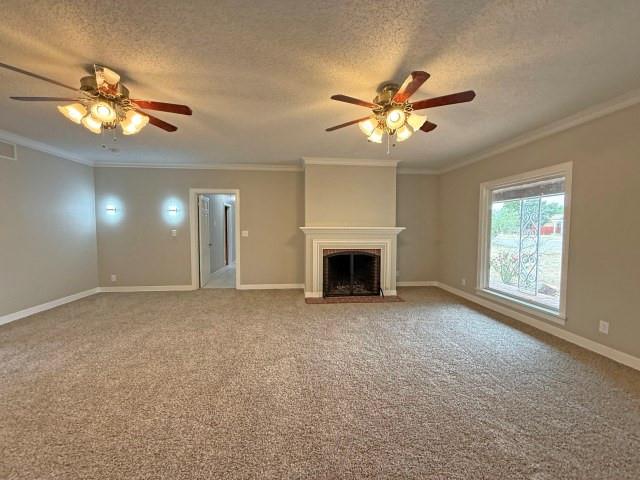 1001 North 3rd Street Lamesa, TX 79331 - Photo 18 of 32 a view of a livingroom with a chandelier fan and windows