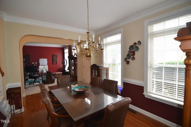 a bathroom with a sink a toilet and shower curtain