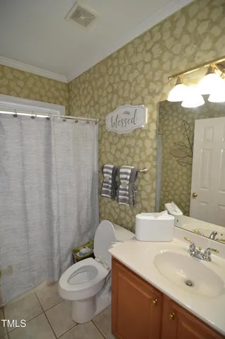 a bedroom with a bed couch and a window