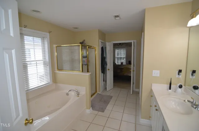 a white bath tub sitting next to a window