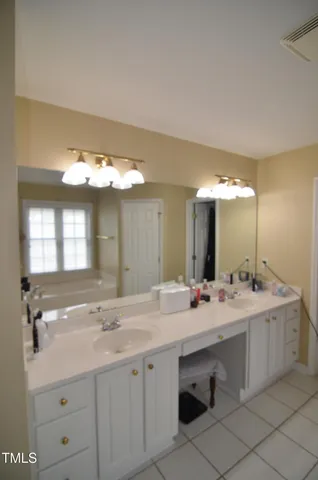 a utility room with sink dryer and washer