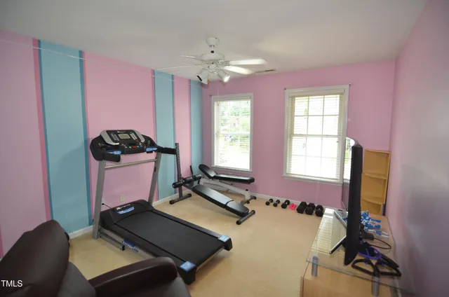 a workspace with furniture bookshelf and a window