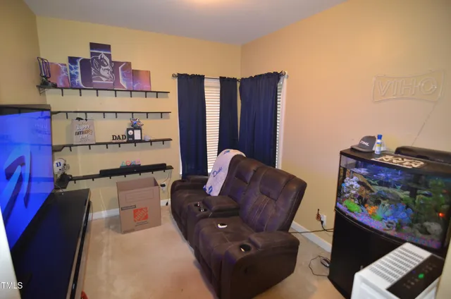 a couch sitting in a room next to a window