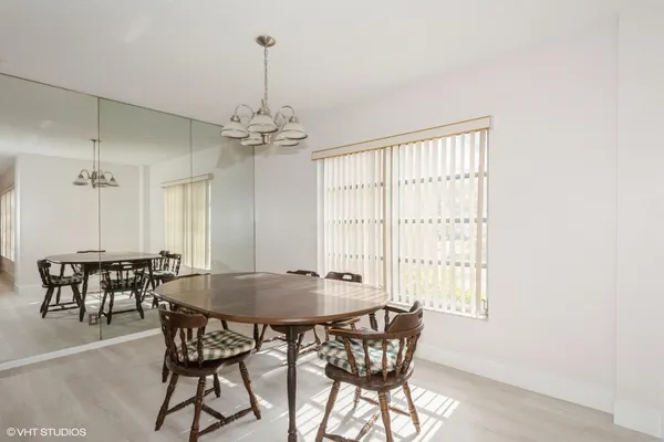 a dining room with furniture and window