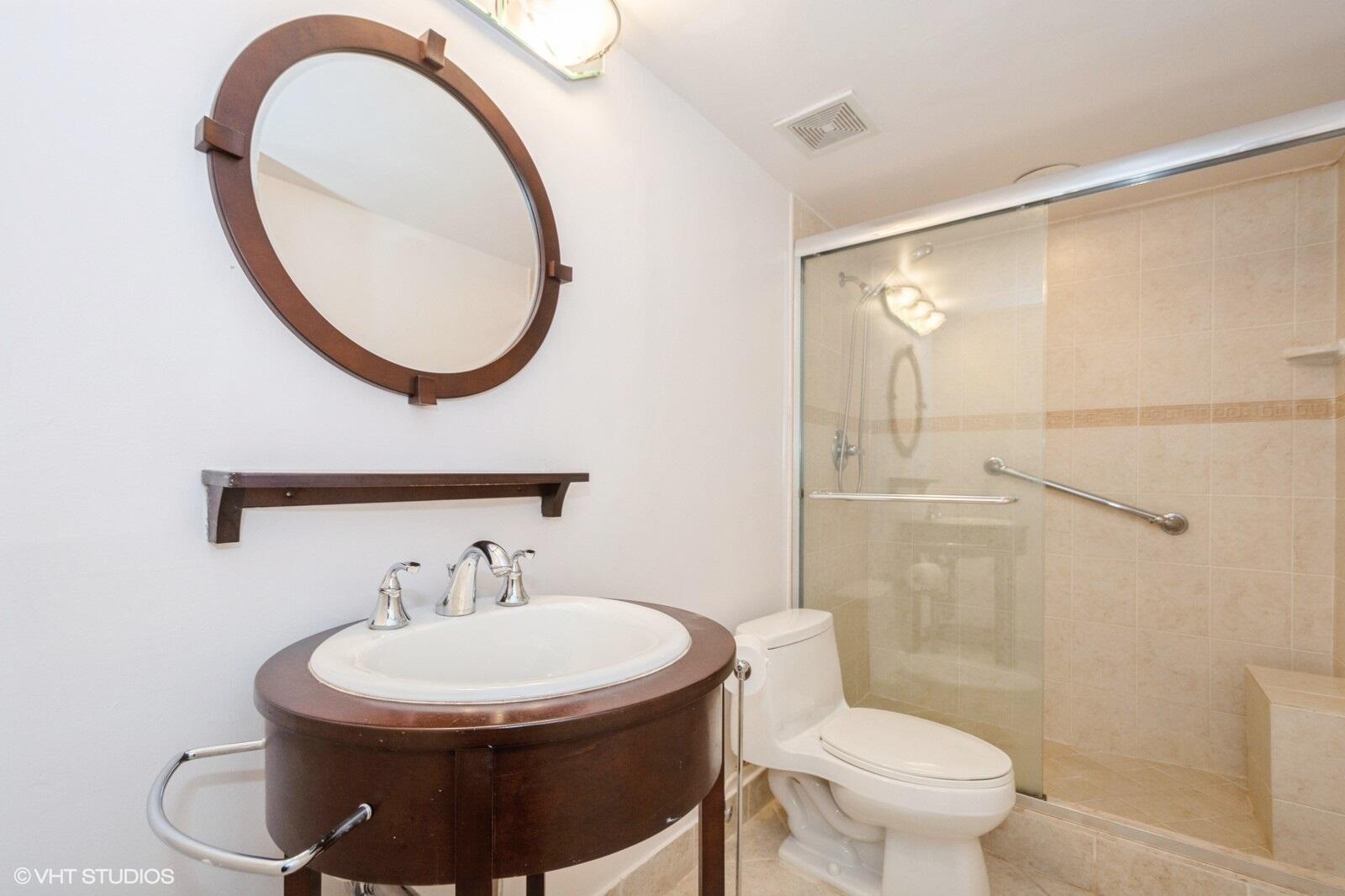 10777 West Sample Road, Unit 101 Coral Springs, FL 33065 - Photo 26 of 36 a bathroom with a sink and a mirror