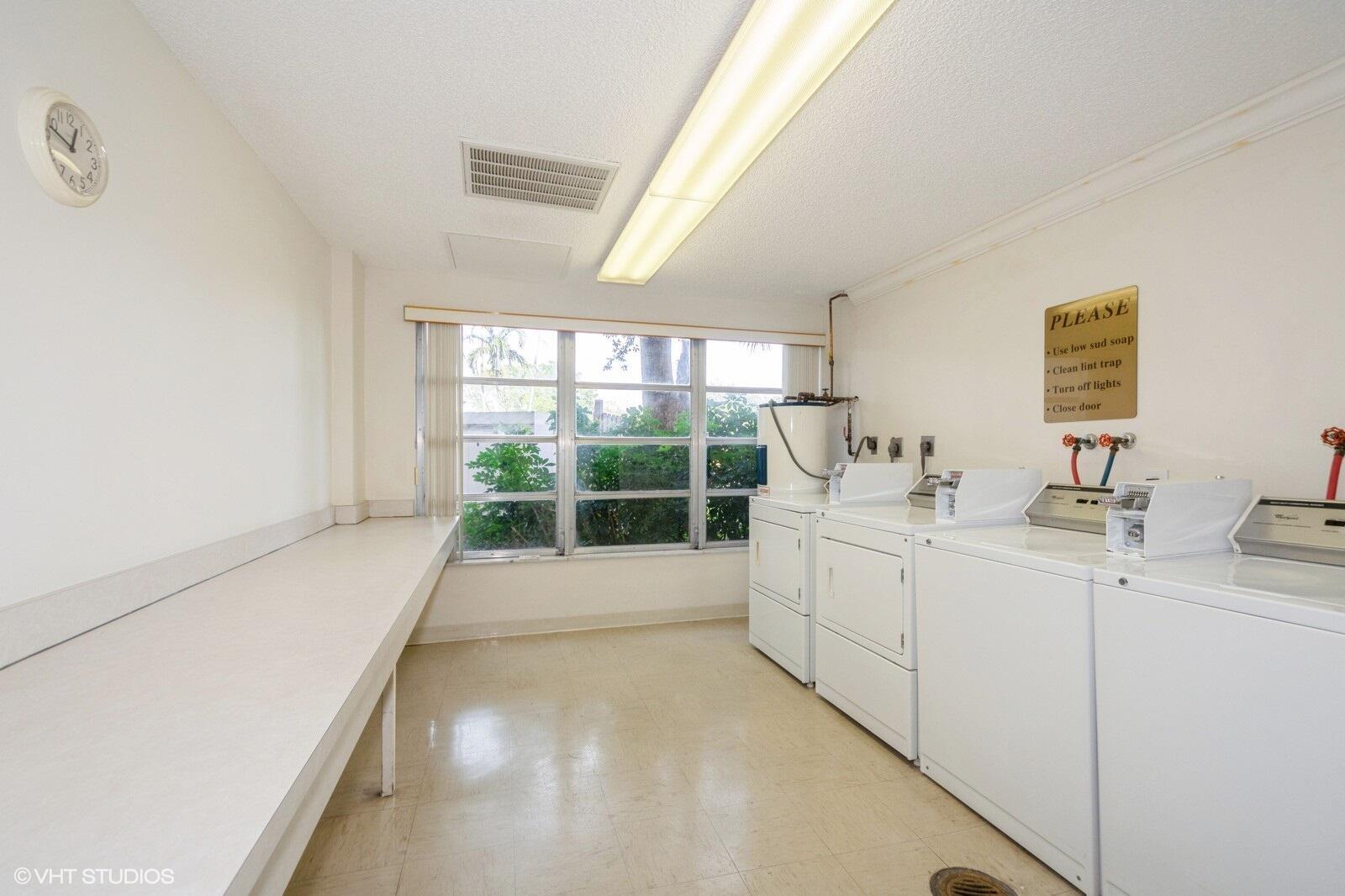 10777 West Sample Road, Unit 101 Coral Springs, FL 33065 - Photo 28 of 36 a room with storage and utility