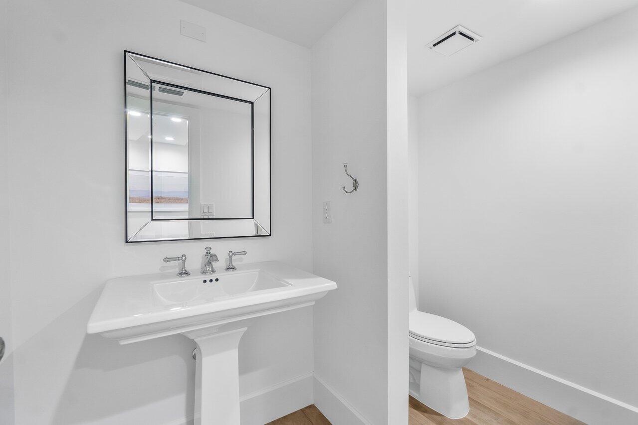 3322 Casseekey Island Road, Unit 202 Jupiter, FL 33477 - Photo 11 of 25 Half Bath in Hallway for Guests