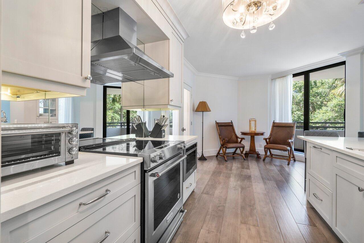 3322 Casseekey Island Road, Unit 202 Jupiter, FL 33477 - Photo 6 of 25 Kitchen with Stainless Steel Appliances