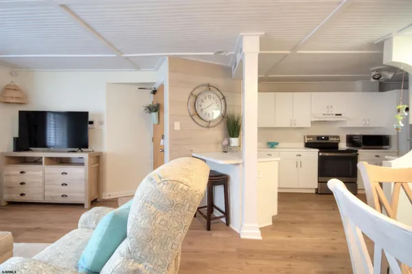 a kitchen with a sink and a stove top oven