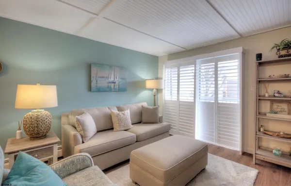 a living room with furniture and flat screen tv