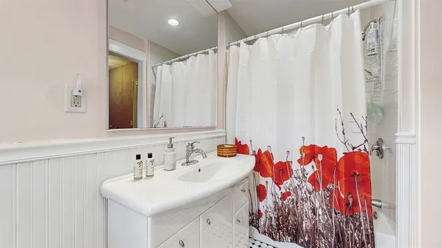 a bathroom with a sink and a mirror
