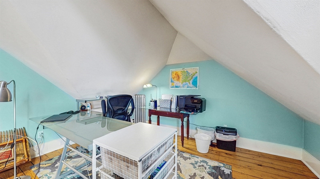 13 Robbins Street, Unit 1 Waltham, MA 02453 - Photo 21 of 29 a living room with furniture and a wooden floor
