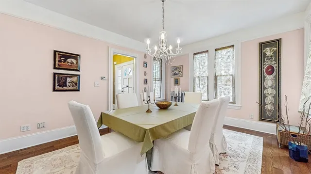 a view of a dining room with furniture and window