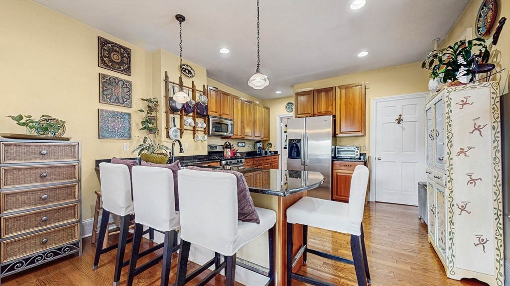 13 Robbins Street, Unit 1 Waltham, MA 02453 - Photo 7 of 29 a view of a dining room with furniture window and wooden floor