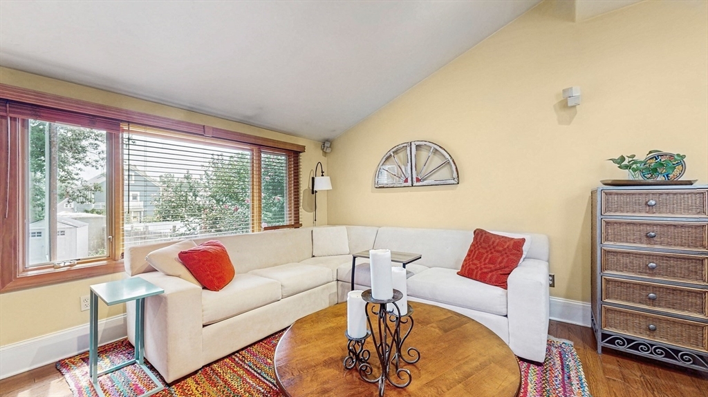 13 Robbins Street, Unit 1 Waltham, MA 02453 - Photo 10 of 29 a living room with furniture and a window