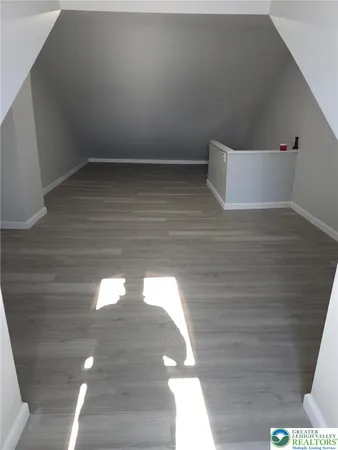 a view of wooden floor with windows