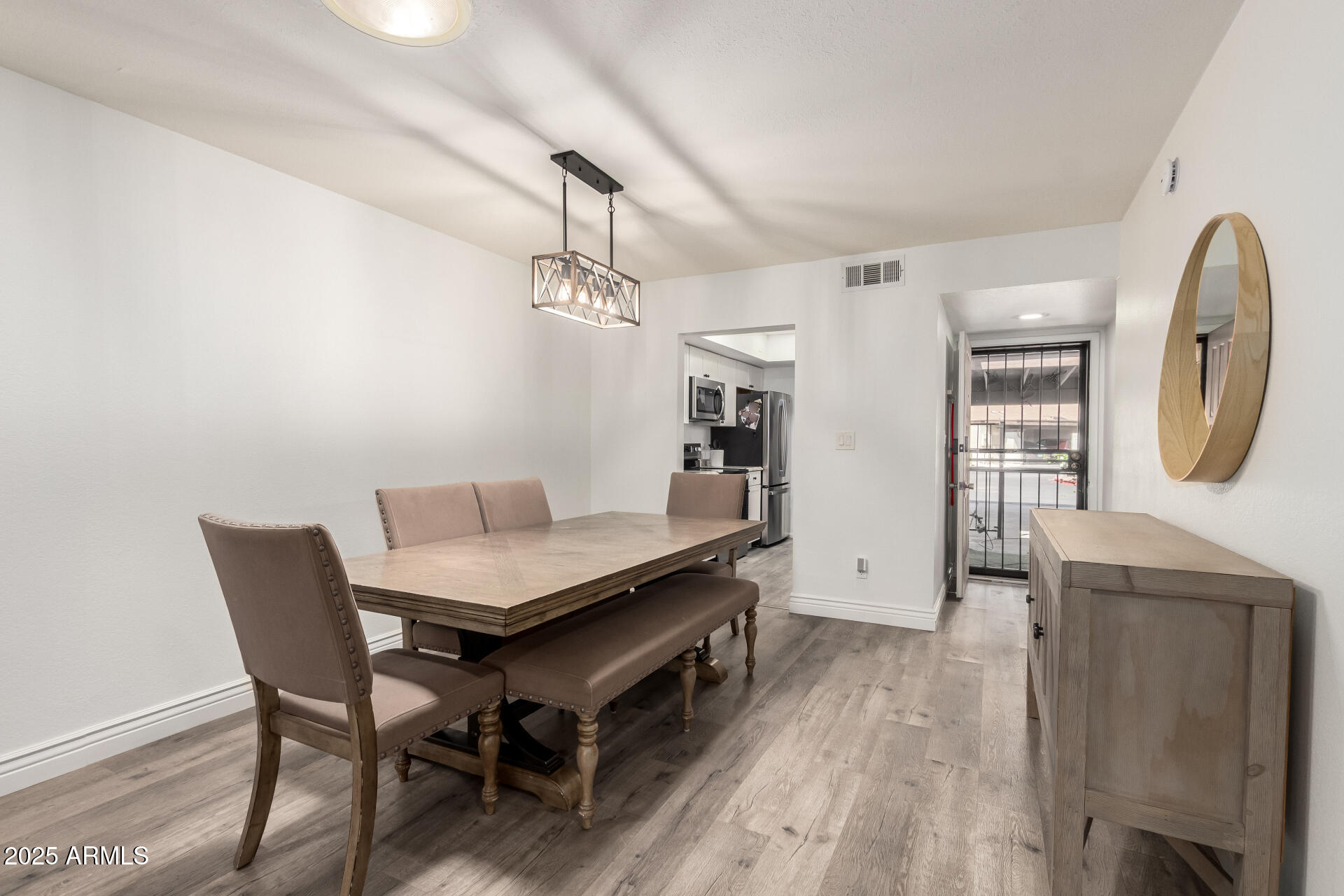 4561 West McLellan Road Glendale, AZ 85301 - Photo 11 of 32 a view of a workspace with furniture and wooden floor