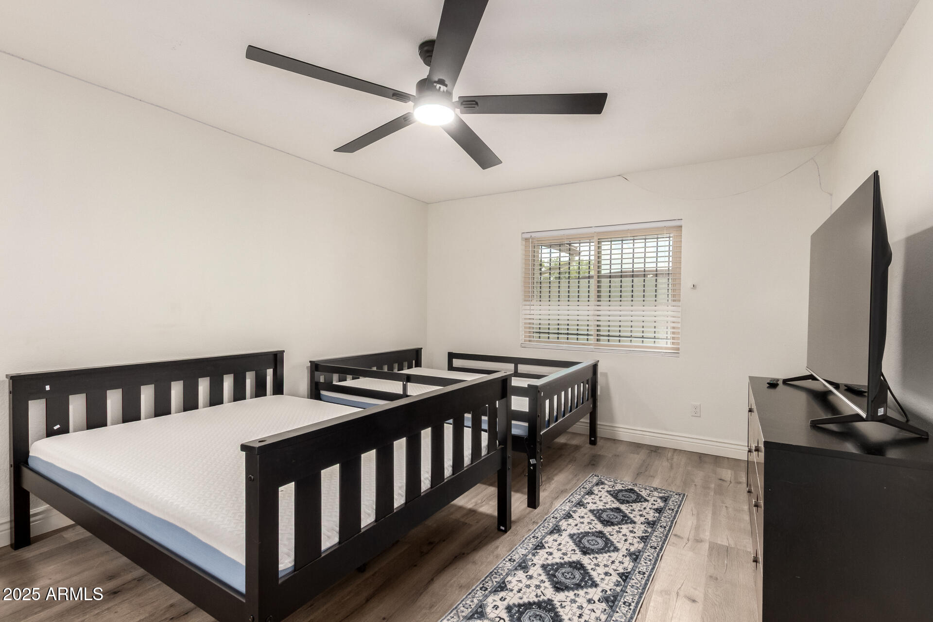 4561 West McLellan Road Glendale, AZ 85301 - Photo 16 of 32 a bedroom with furniture and a window