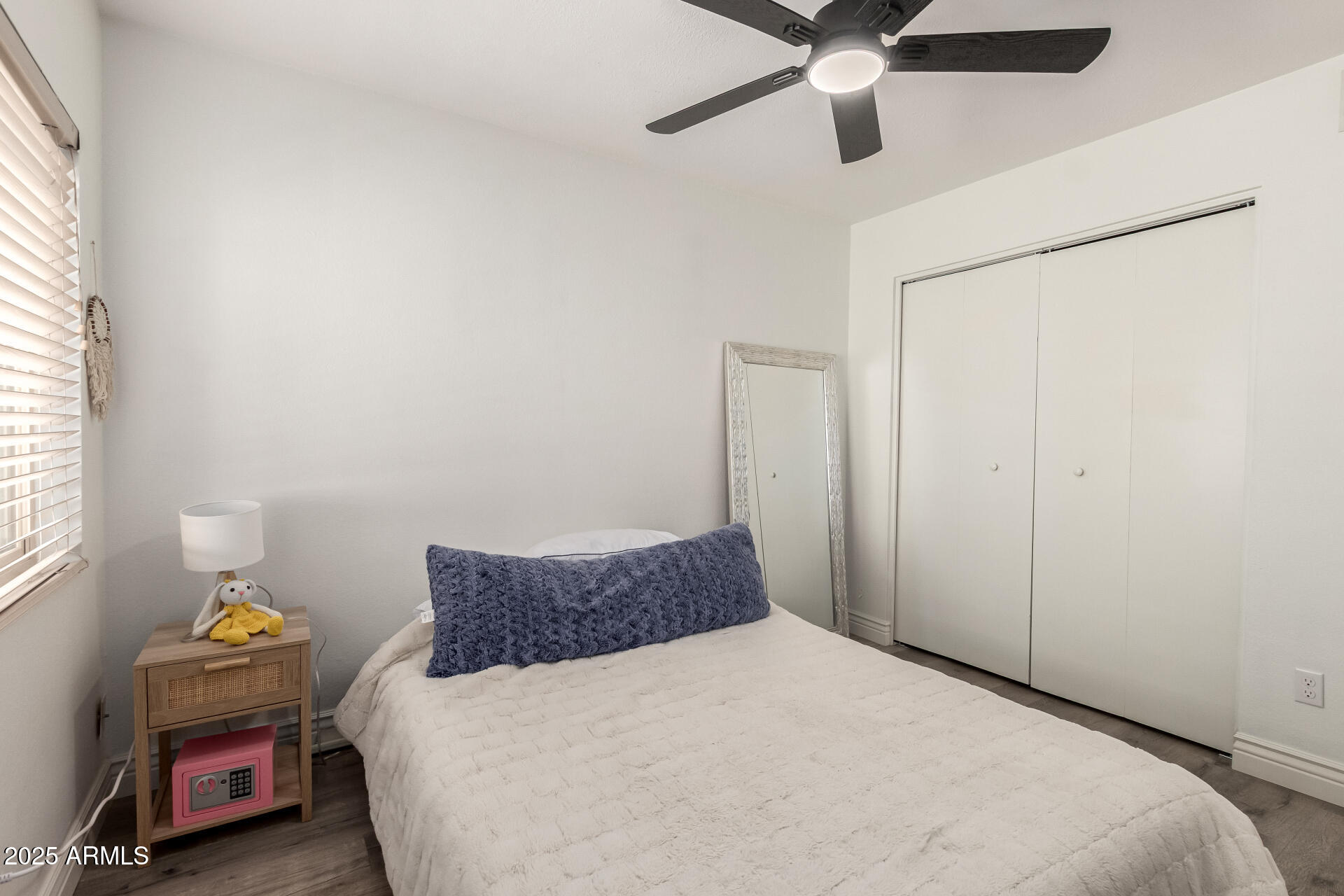 4561 West McLellan Road Glendale, AZ 85301 - Photo 22 of 32 a bedroom with a bed and a window