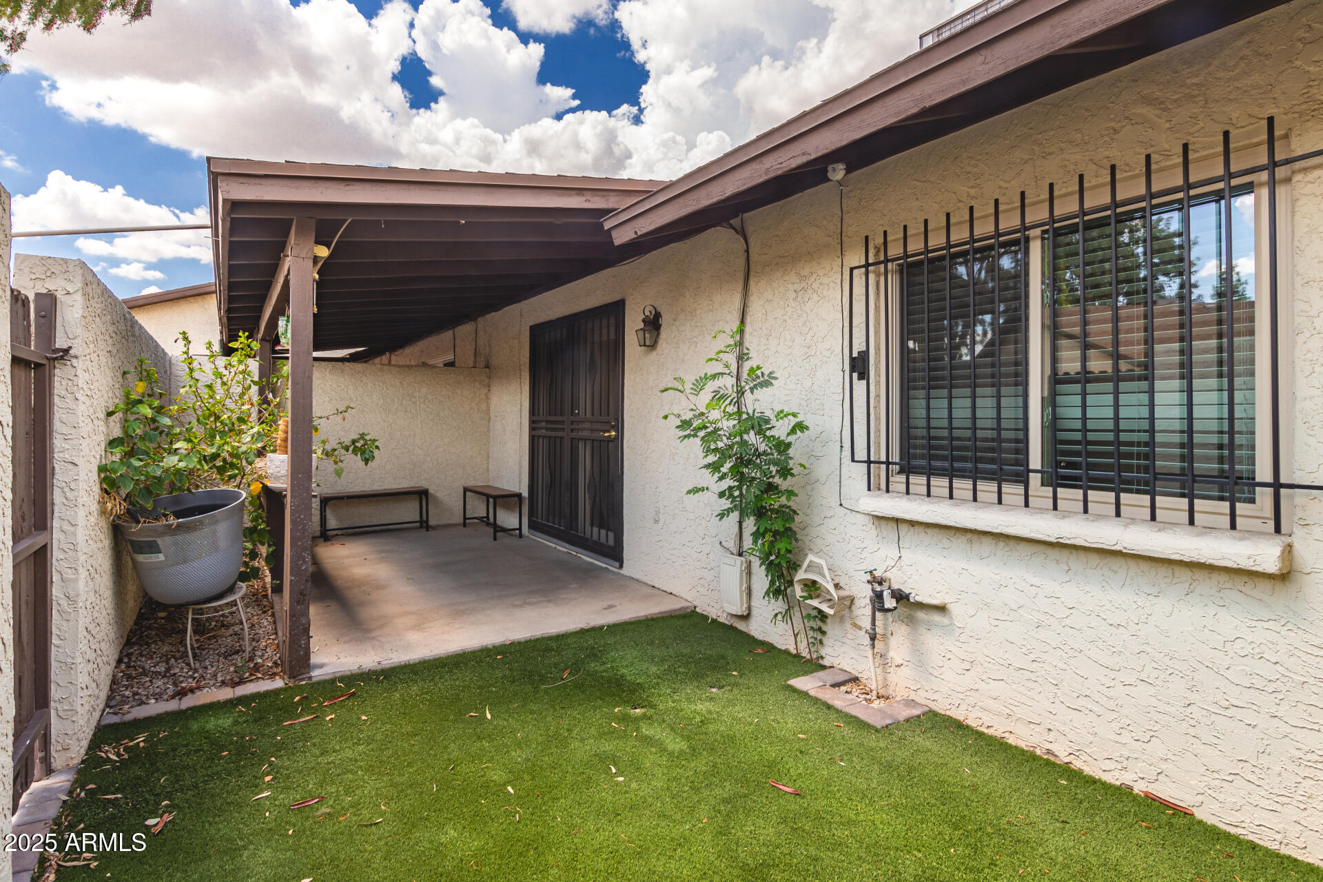 4561 West McLellan Road Glendale, AZ 85301 - Photo 28 of 32 a view of an house with backyard space and garden