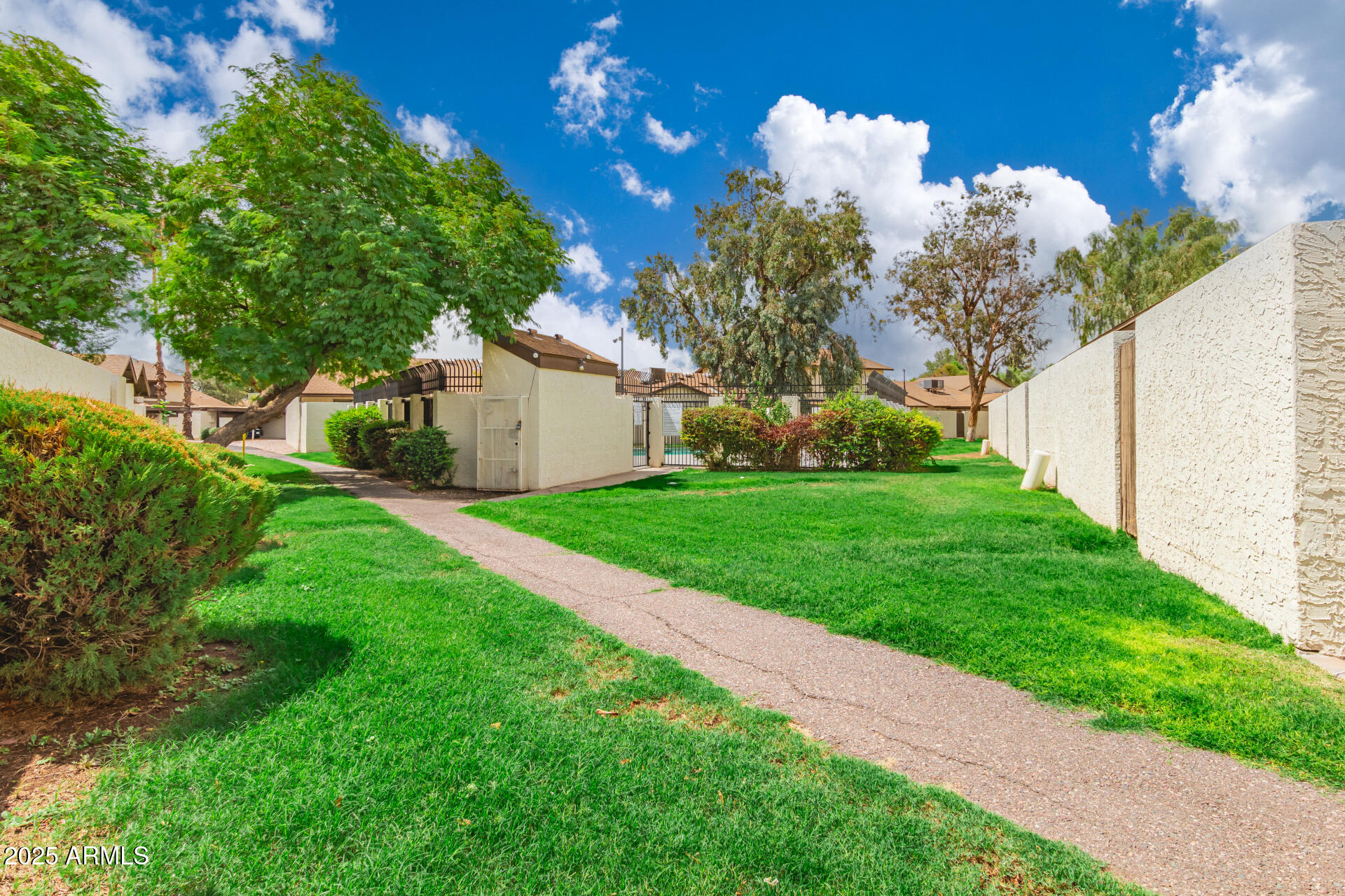 4561 West McLellan Road Glendale, AZ 85301 - Photo 30 of 32 a view of a house with a yard