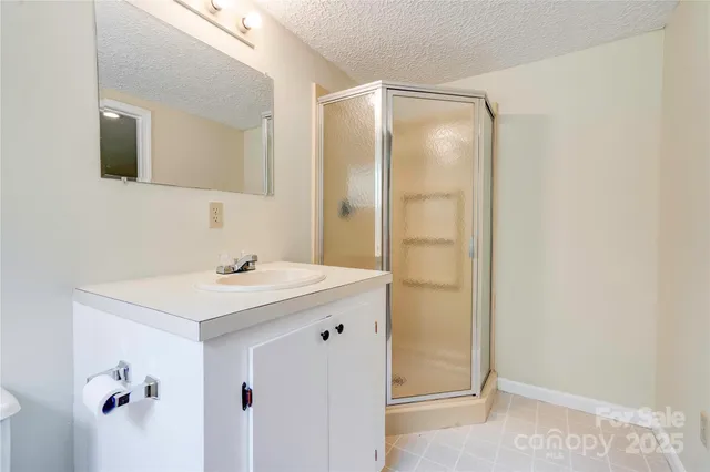 a bathroom with a toilet a sink and a mirror