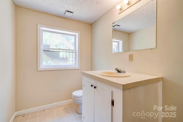 a view of wooden balcony and trees