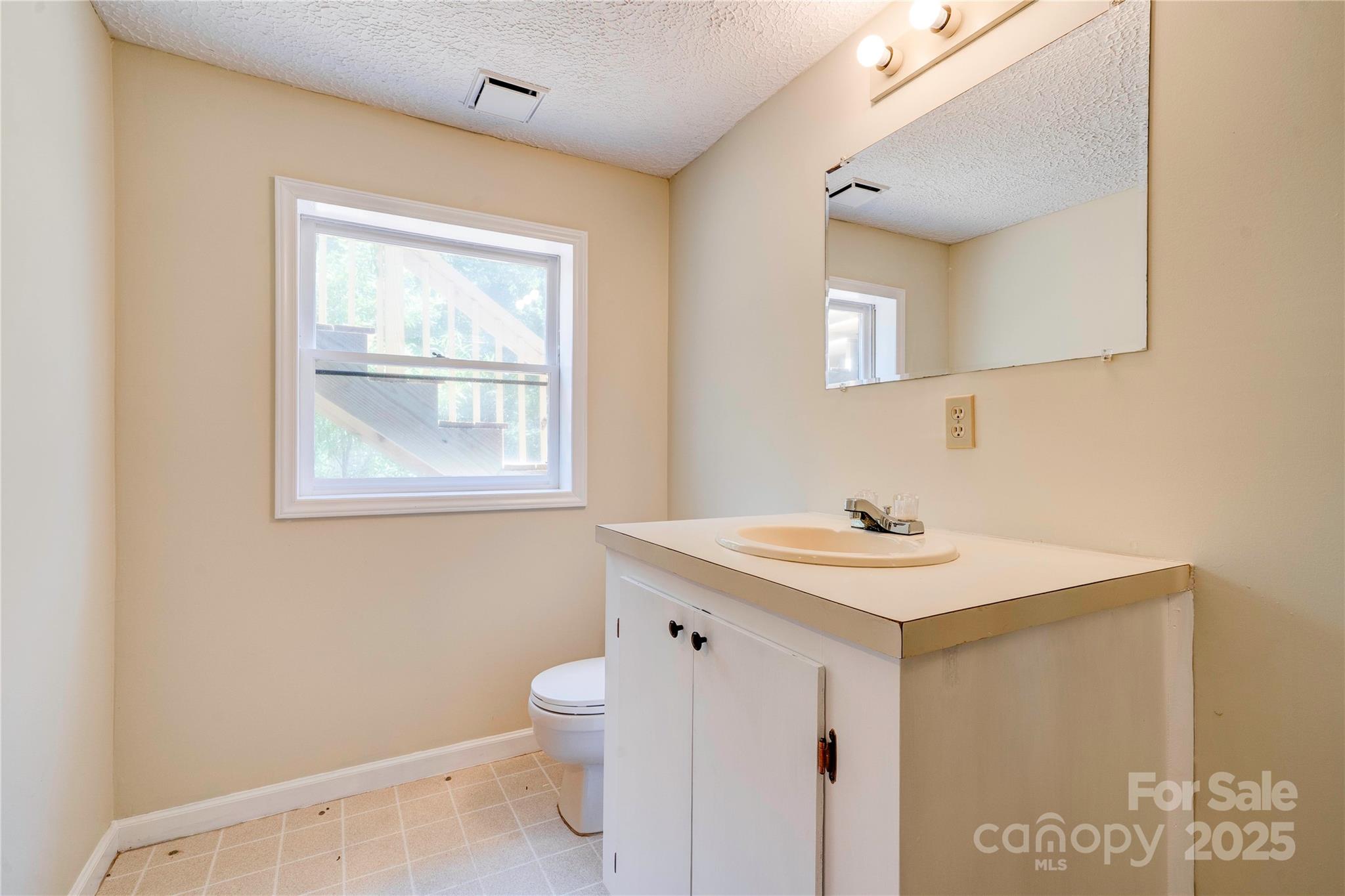 145 Ball Park Road Lawndale, NC 28090 - Photo 28 of 37 a view of a bathroom with a sink and a mirror