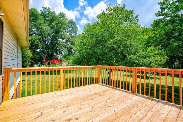 a view of a balcony with a swimming pool