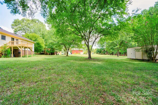 a backyard of a house with lots of green space